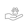 Animals help concept. Animal footprint paw and human hand. Voluntary line icon. Royalty Free Stock Photo